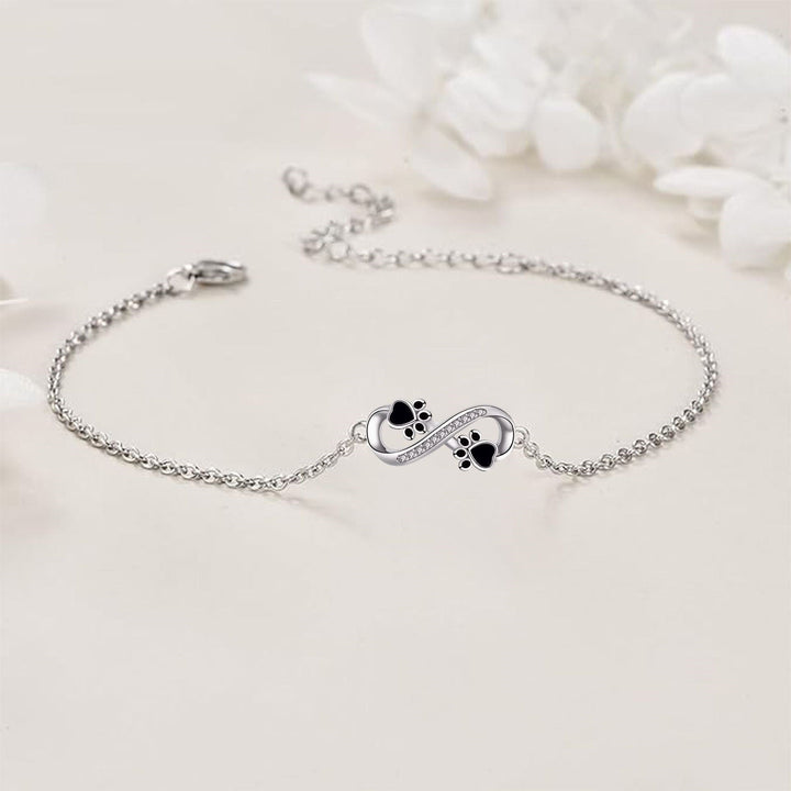 Infinite symbolhalsband med tassarmband med zirkonior